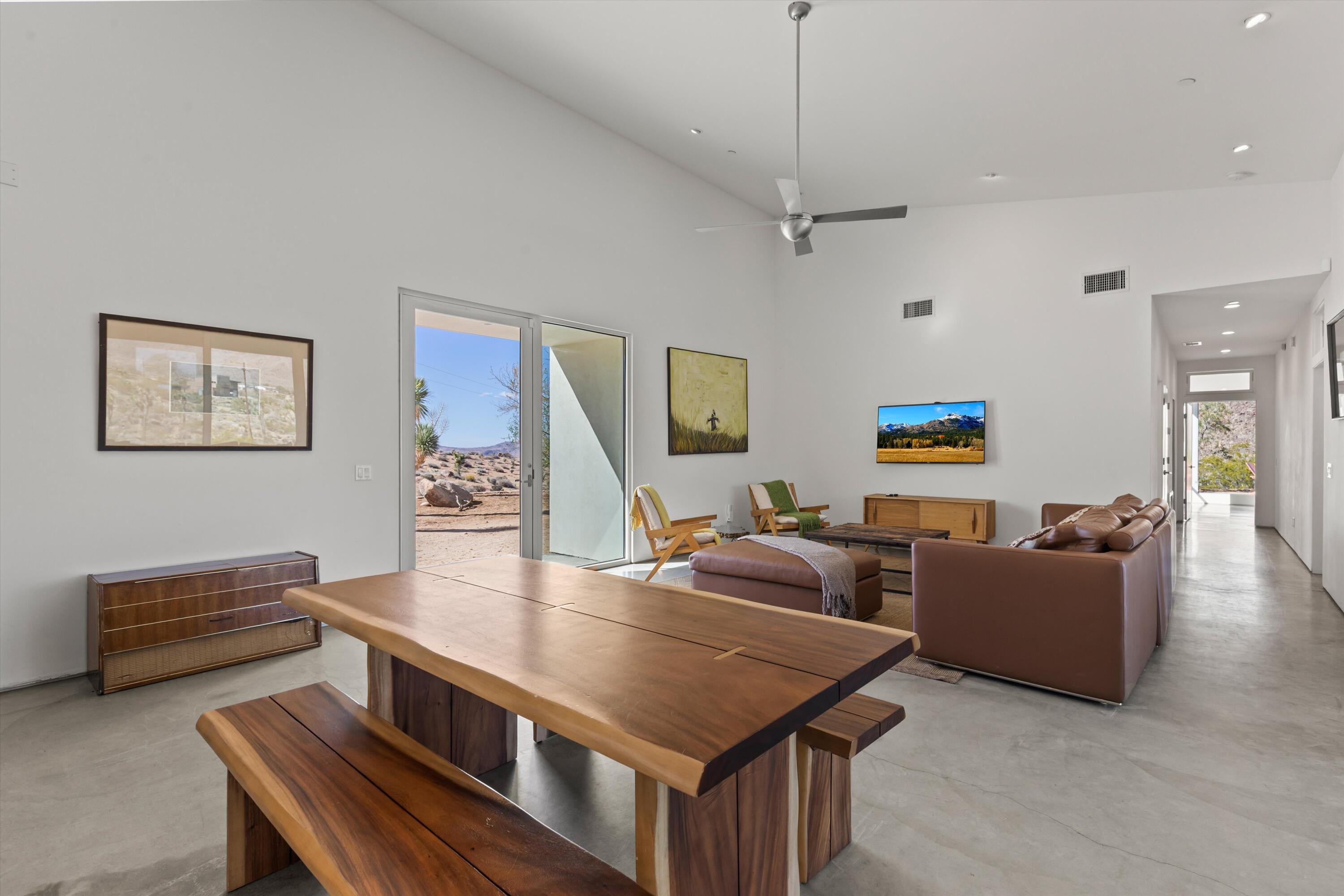 8825 Lilley Road Joshua Tree, CA 92252 - Photo 11 of 56 a living room with furniture and a wooden floor