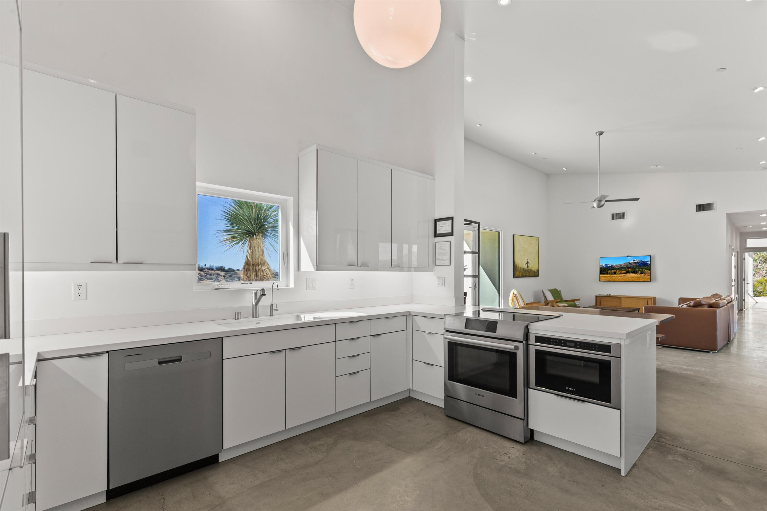 8825 Lilley Road Joshua Tree, CA 92252 - Photo 15 of 56 a kitchen that has a sink and a stove in it