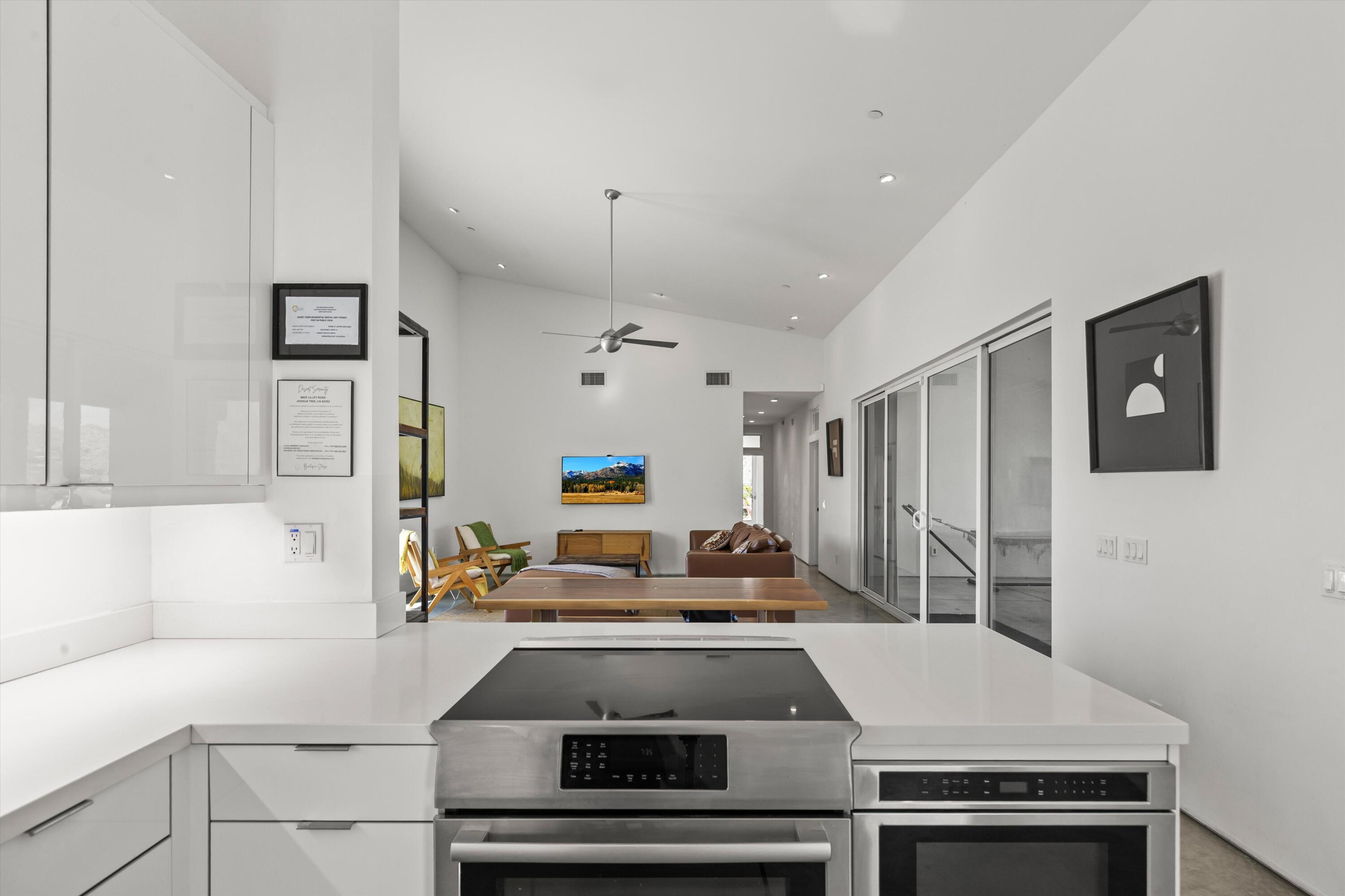 8825 Lilley Road Joshua Tree, CA 92252 - Photo 16 of 56 a kitchen with stainless steel appliances a stove and a refrigerator