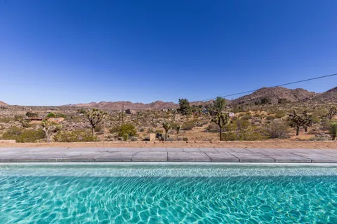 an aerial view of residential house with outdoor space and mountain view