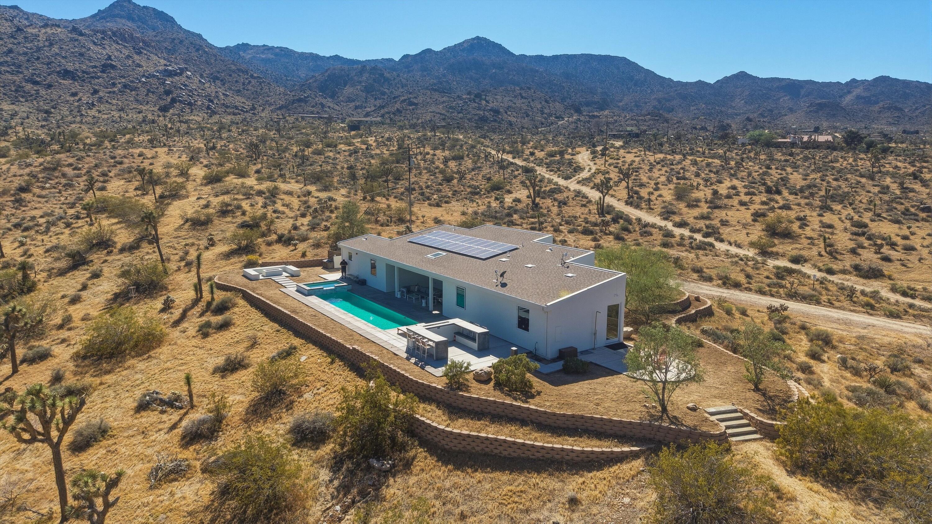 8825 Lilley Road Joshua Tree, CA 92252 - Photo 2 of 56 an aerial view of house with yard
