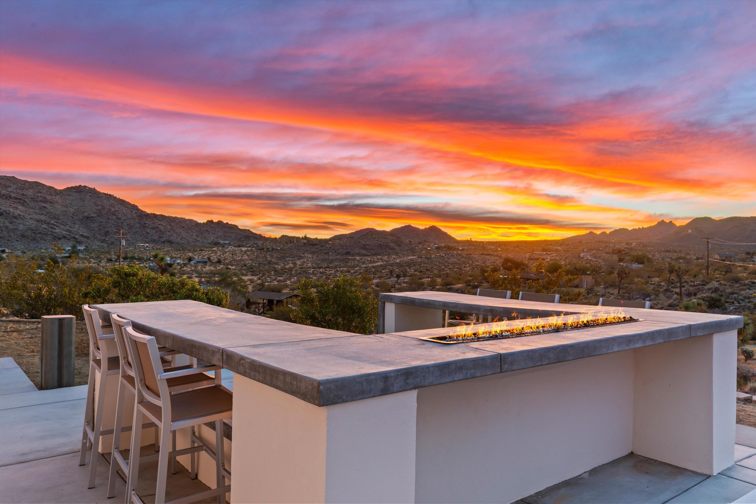 8825 Lilley Road Joshua Tree, CA 92252 - Photo 24 of 56 a view of a terrace with a table and chairs