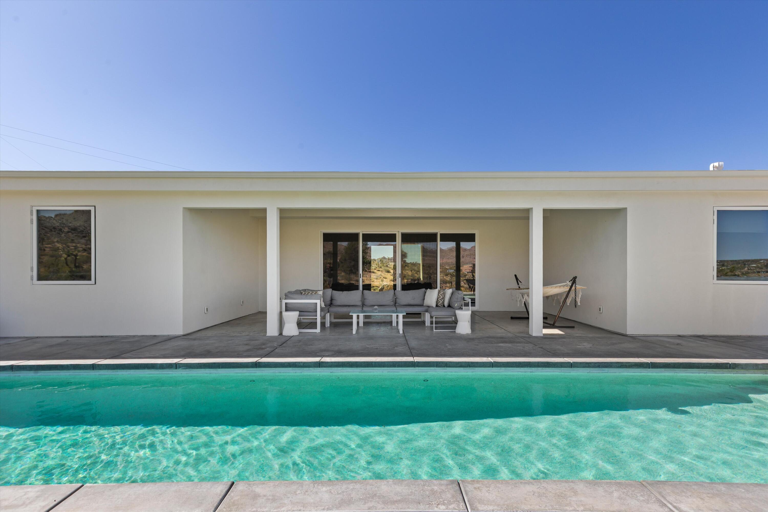 8825 Lilley Road Joshua Tree, CA 92252 - Photo 27 of 56 a front view of house with yard and outdoor seating