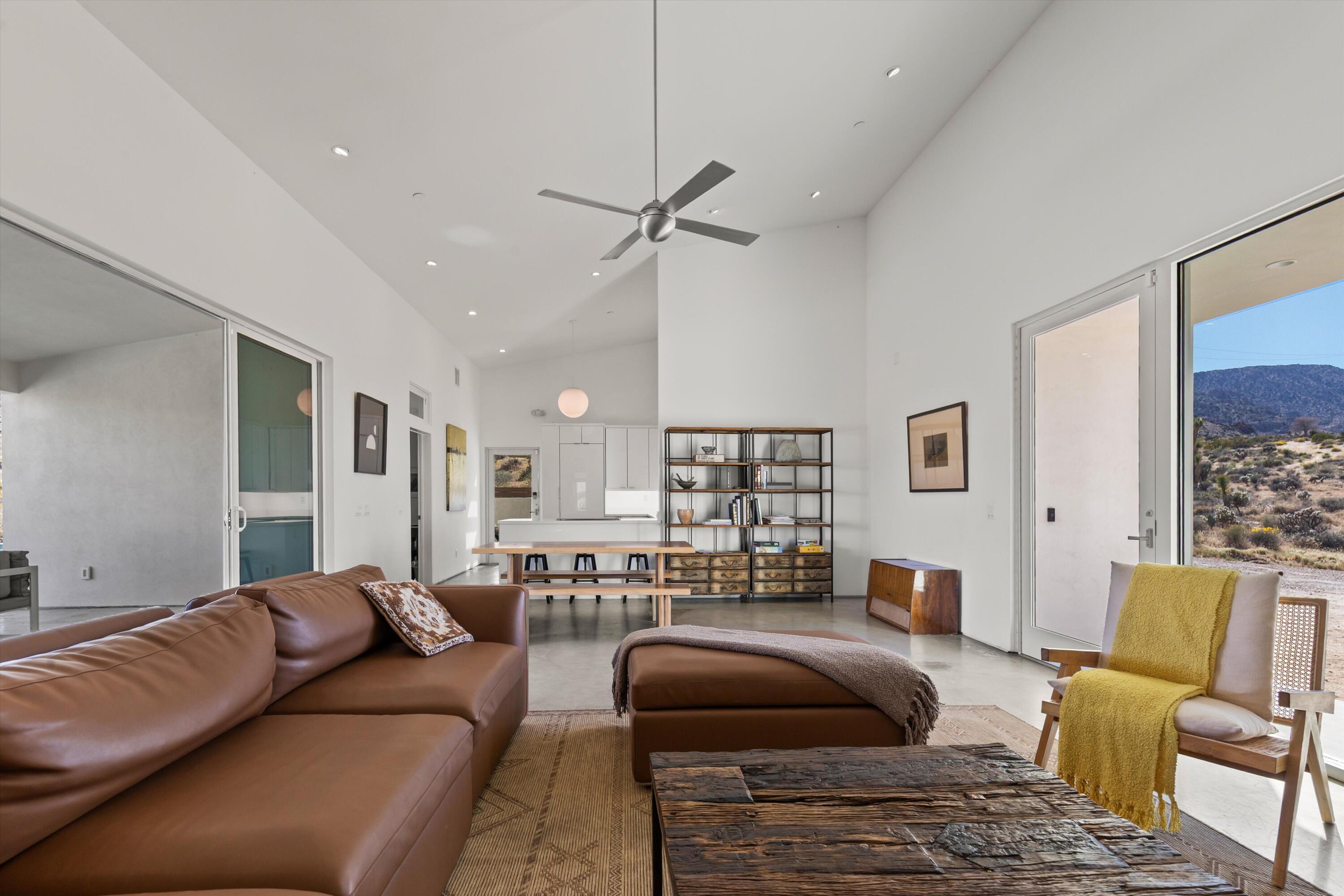 8825 Lilley Road Joshua Tree, CA 92252 - Photo 28 of 56 a living room with furniture and a large window
