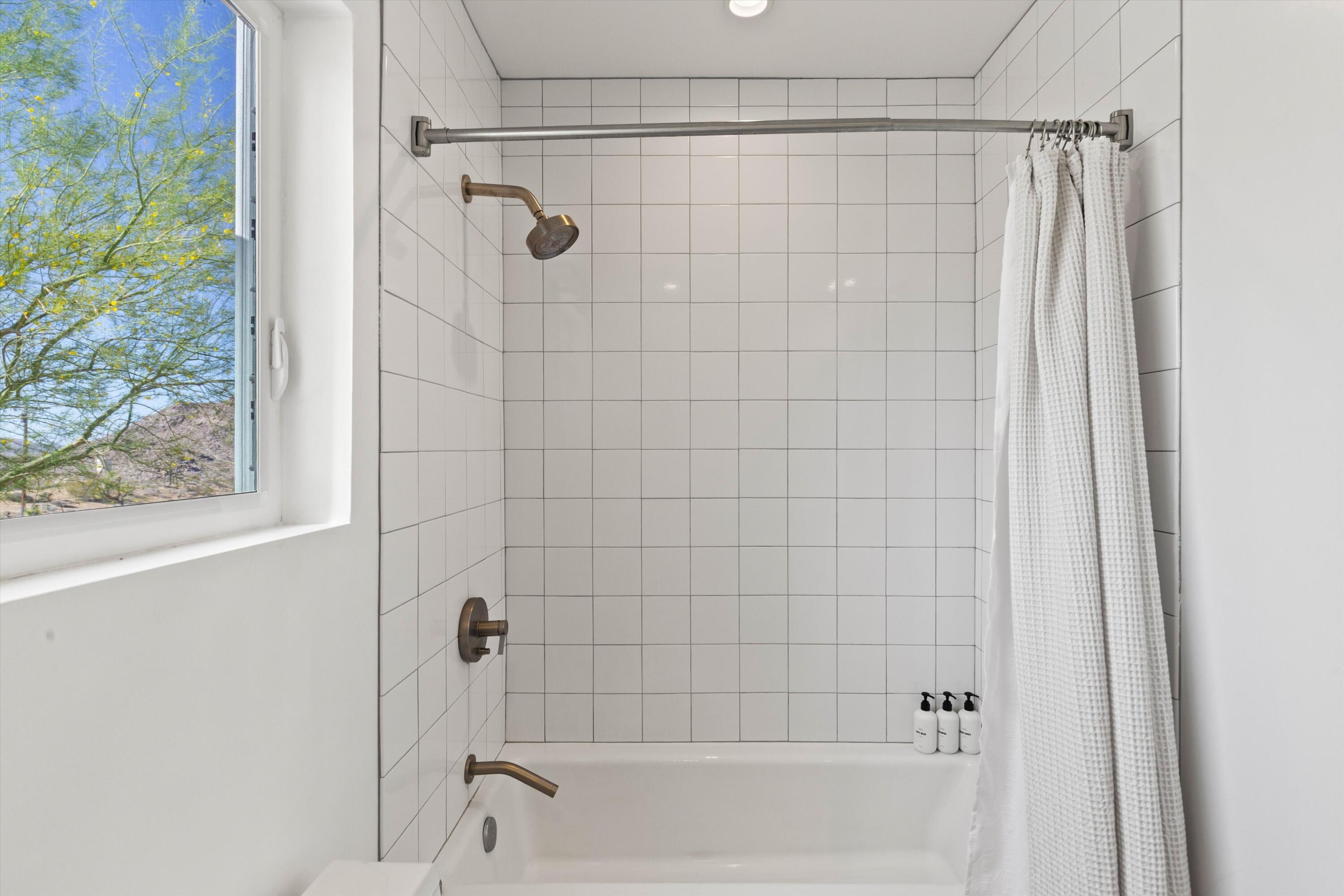 8825 Lilley Road Joshua Tree, CA 92252 - Photo 38 of 56 a bathroom with a shower and a bathtub