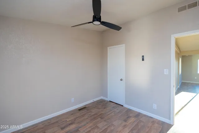 a view of a room with a barbeque and wooden floor