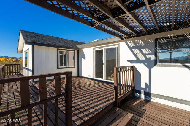 a view of a balcony with wooden floor