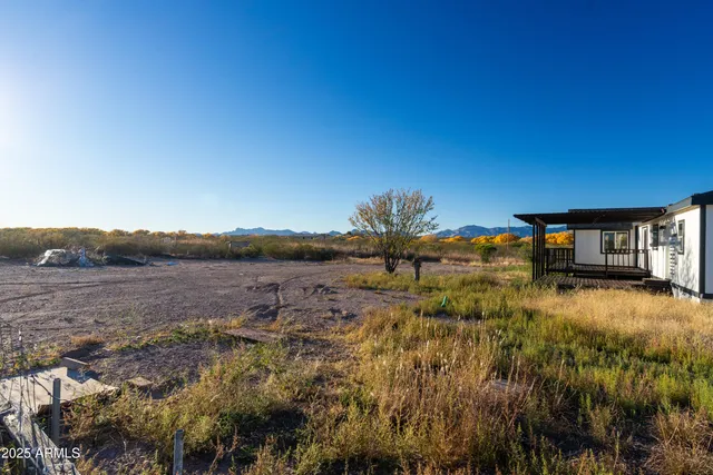 a view of a lake with a yard