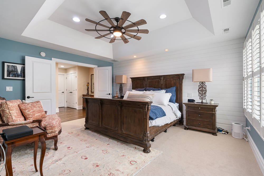 2028 Maple Avenue Northbrook, IL 60062 - Photo 12 of 26 a bed room with furniture and a flat screen tv