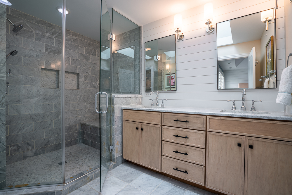 2028 Maple Avenue Northbrook, IL 60062 - Photo 13 of 26 a bathroom with a shower sink and mirror