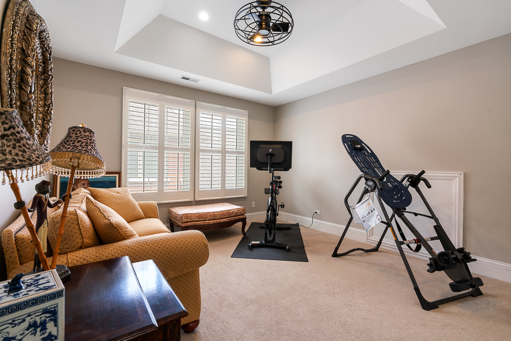 2028 Maple Avenue Northbrook, IL 60062 - Photo 17 of 26 a living room with furniture a air conditioner and a large window