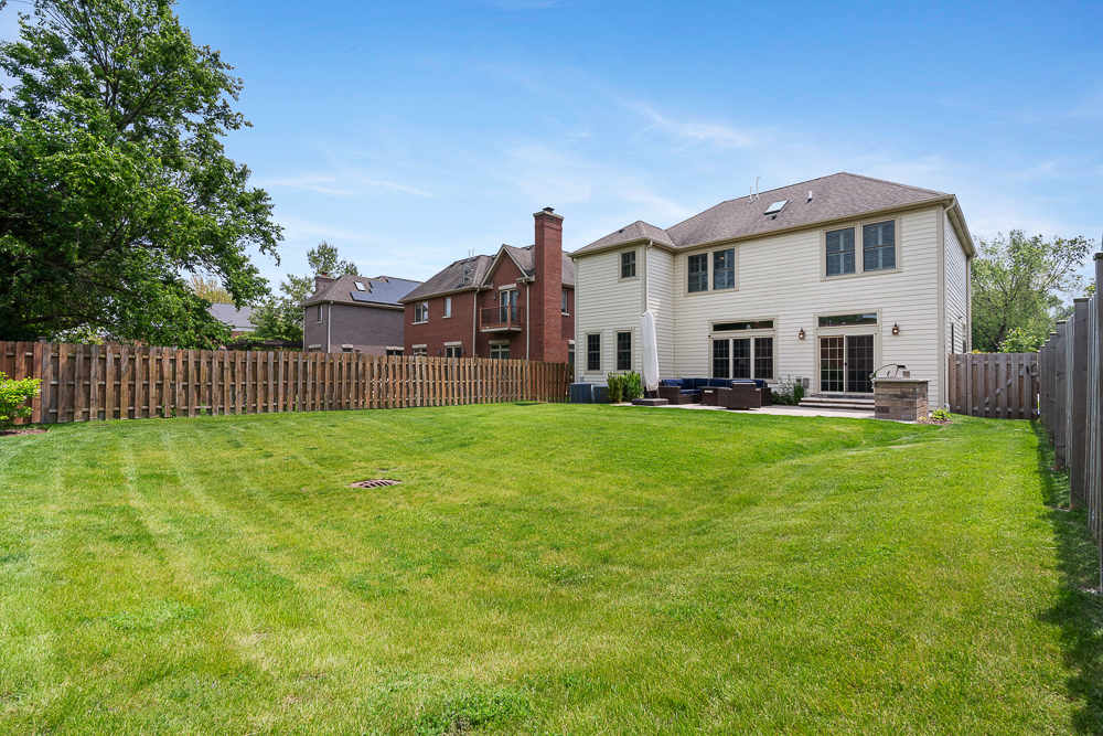 2028 Maple Avenue Northbrook, IL 60062 - Photo 22 of 26 a front view of a house with garden