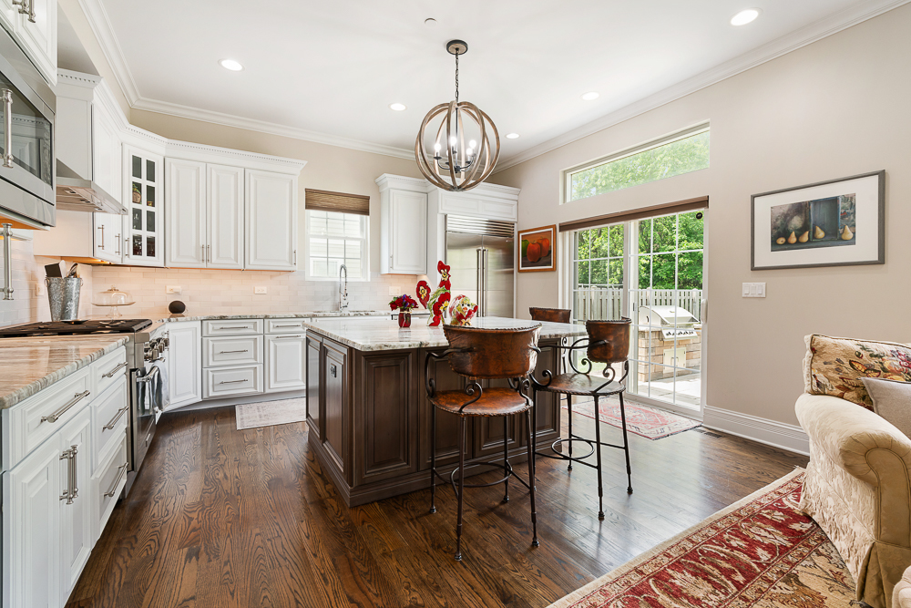 2028 Maple Avenue Northbrook, IL 60062 - Photo 4 of 26 a view of a dining room with furniture window and wooden floor