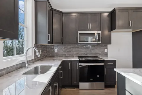 a kitchen with a stove and a sink