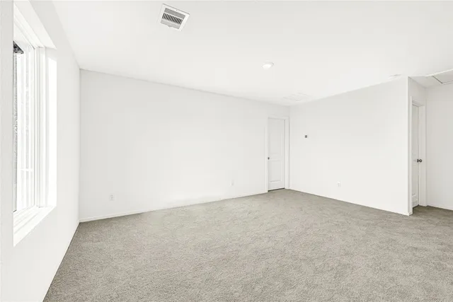 an empty room with a natural light