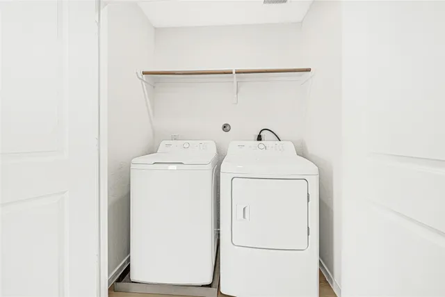 a utility room with dryer and washer