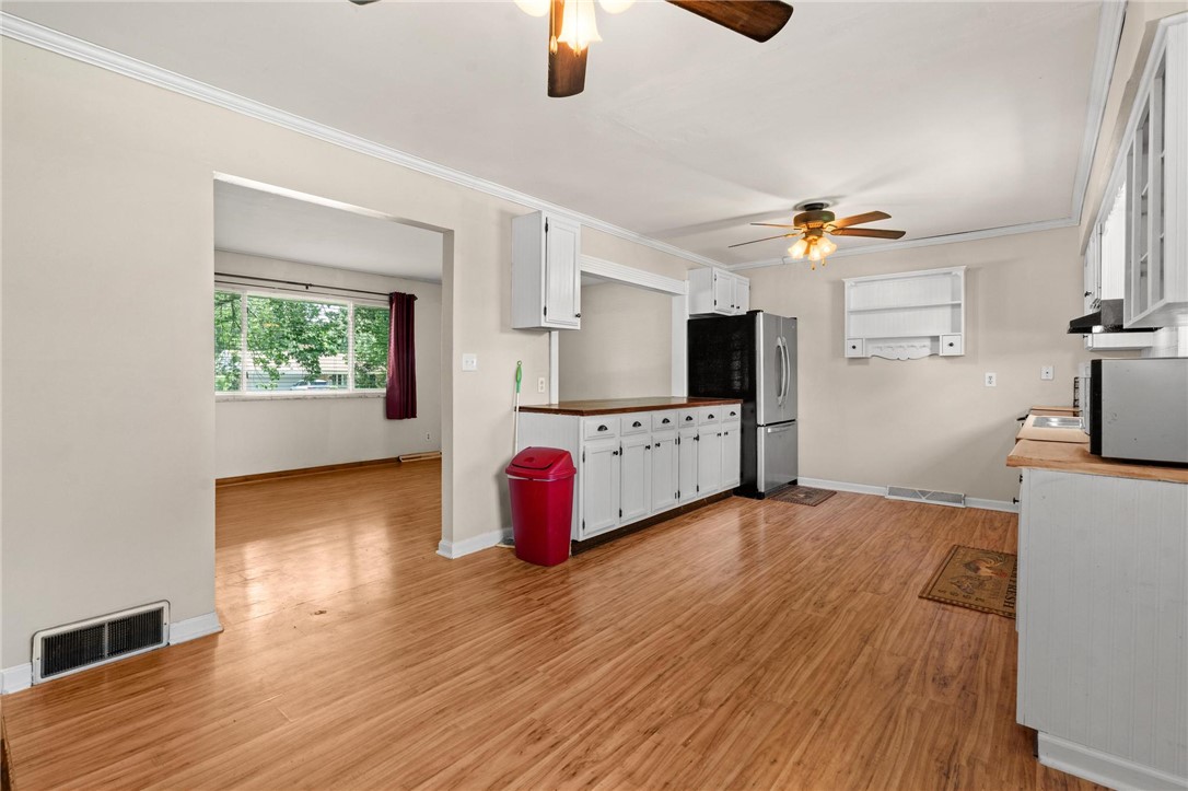 4150 Rose Marie Road Franklin, OH 45005 - Photo 21 of 36 A well-appointed kitchen features warm wood flooring and ample cabinetry for culinary pursuits.