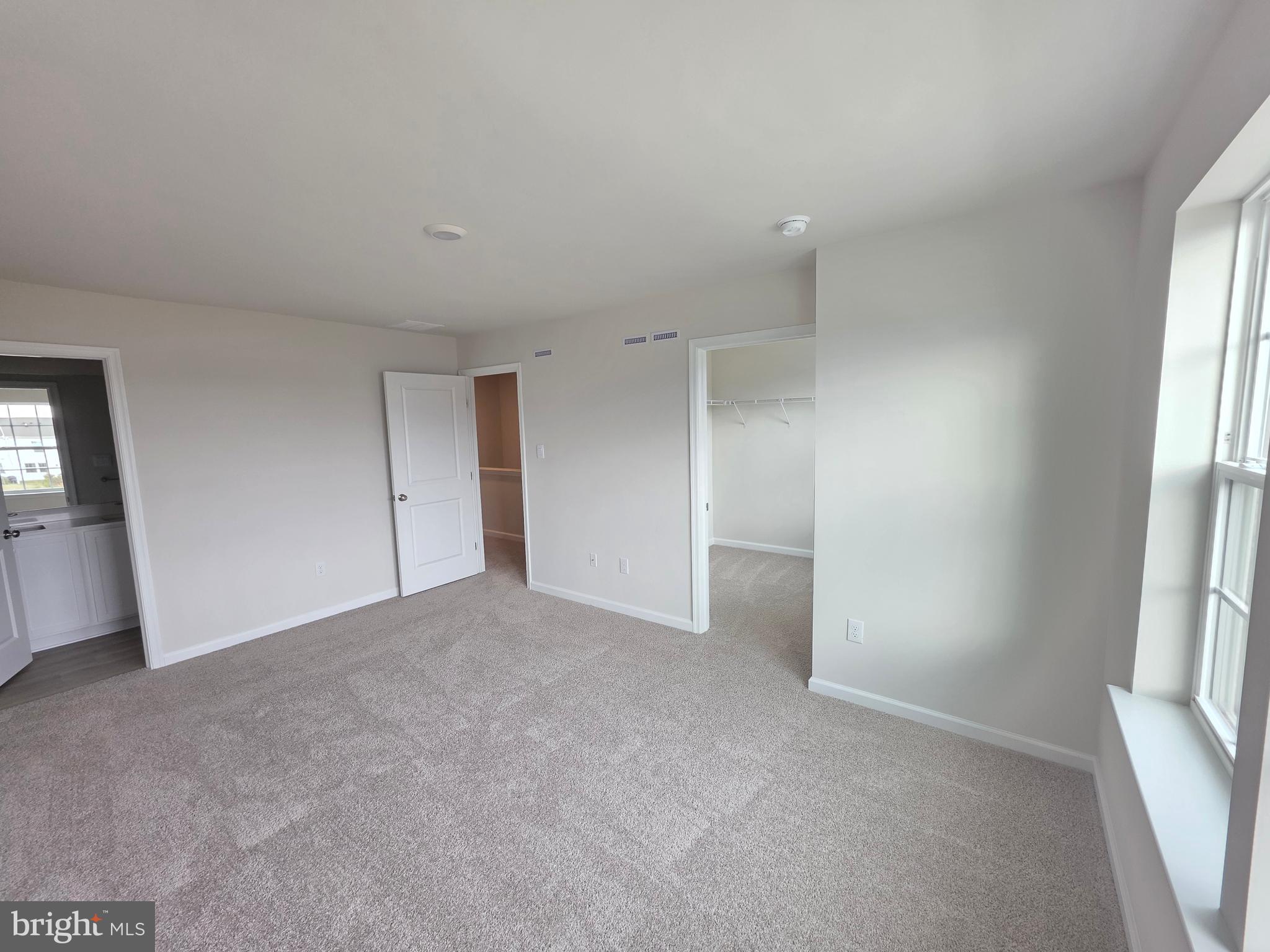 57 Alexander Way Westampton, NJ 08060 - Photo 22 of 27 an empty room with windows and closet