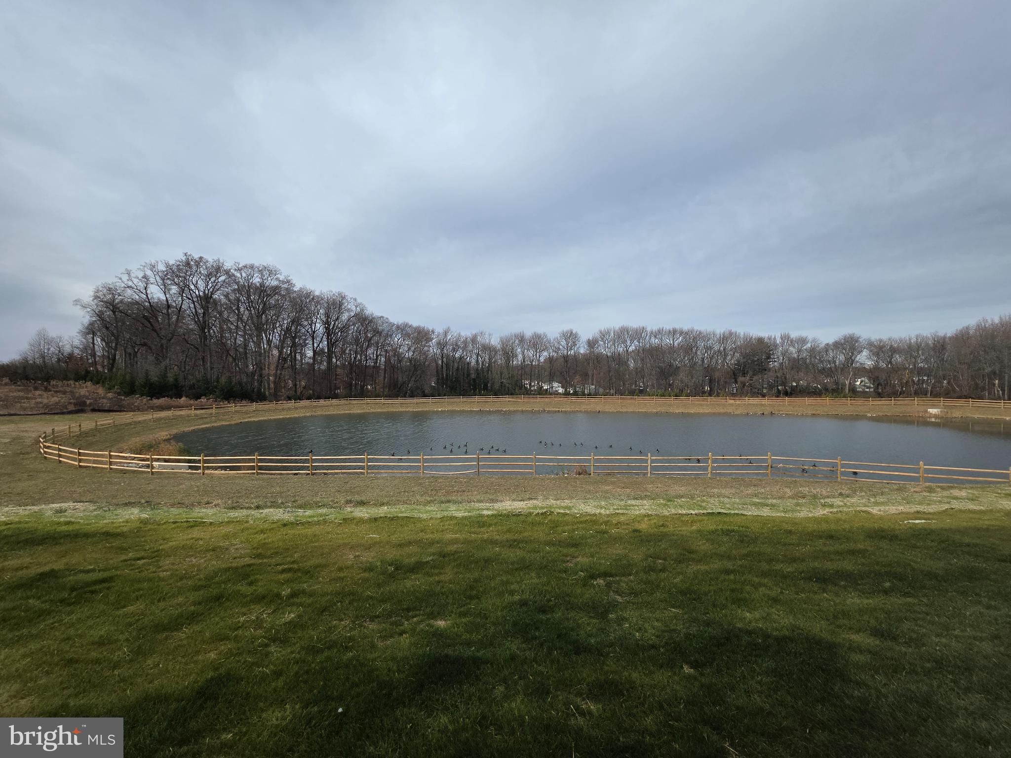 57 Alexander Way Westampton, NJ 08060 - Photo 25 of 27 a view of a lake with houses in the back