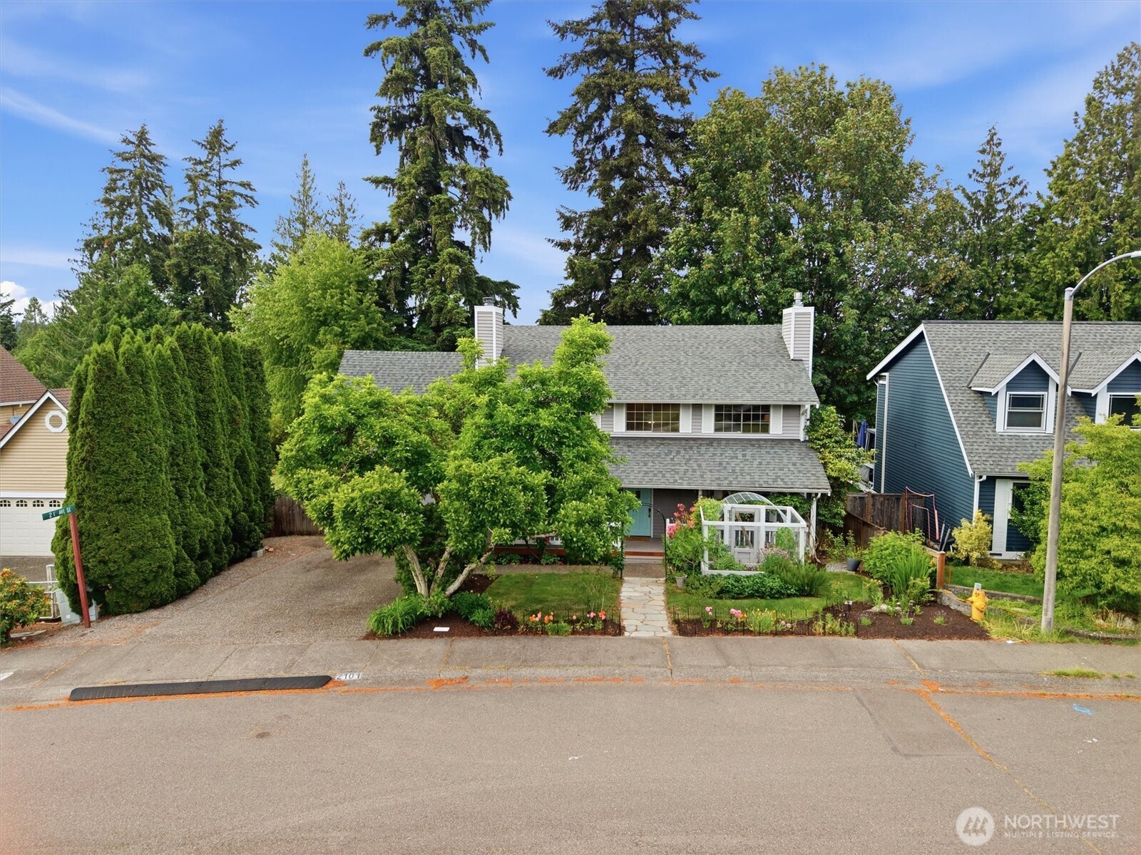 2101 233rd Street Southeast Bothell, WA 98021 - Photo 39 of 40 front view of a house next to a yard