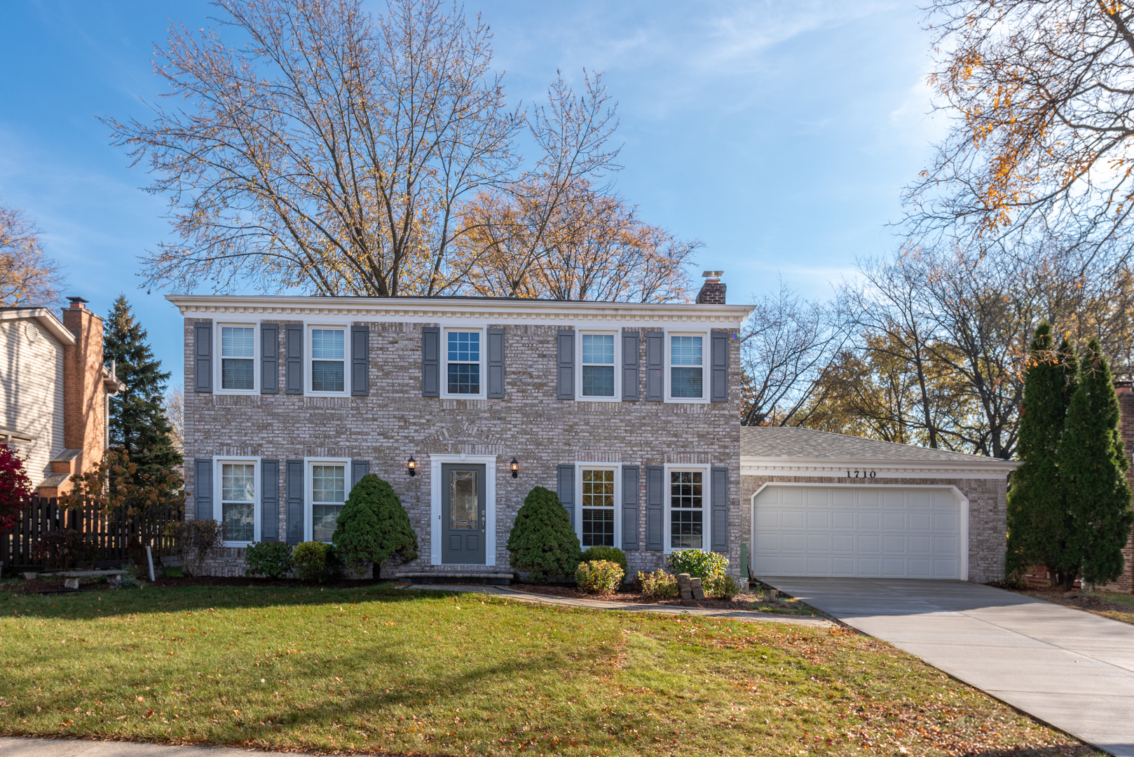 1710 Fender Road Naperville, IL 60565 - Photo 1 of 46 a front view of a house with a yard and garage