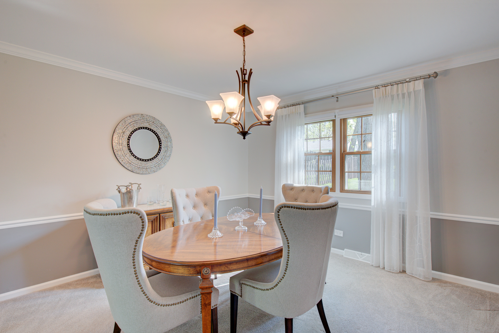 1710 Fender Road Naperville, IL 60565 - Photo 16 of 46 a view of a dining room with furniture and chandelier