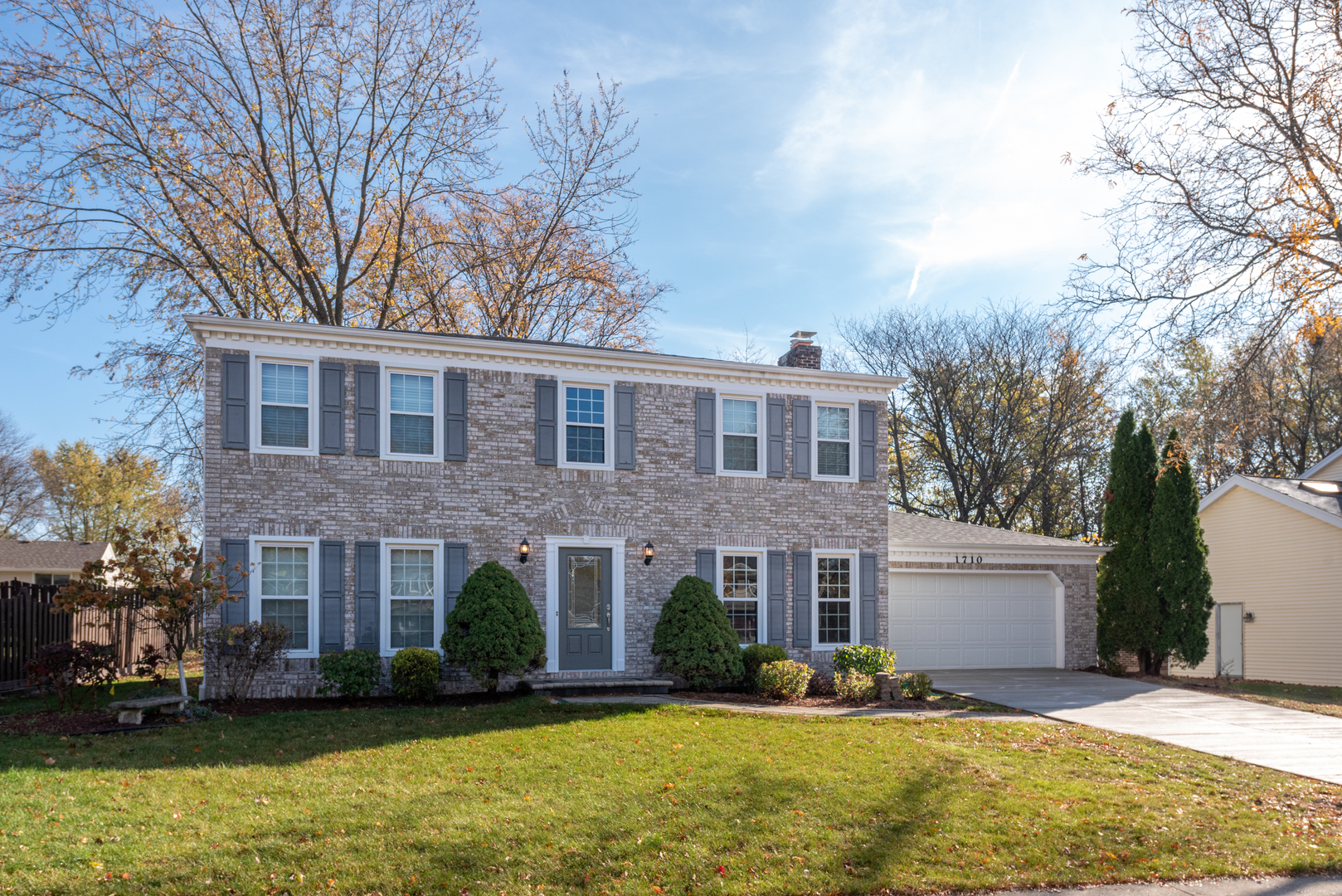 1710 Fender Road Naperville, IL 60565 - Photo 2 of 46 a front view of a building with a yard