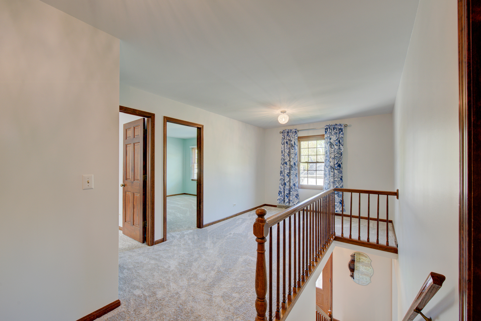 1710 Fender Road Naperville, IL 60565 - Photo 23 of 46 a view of a hallway with windows