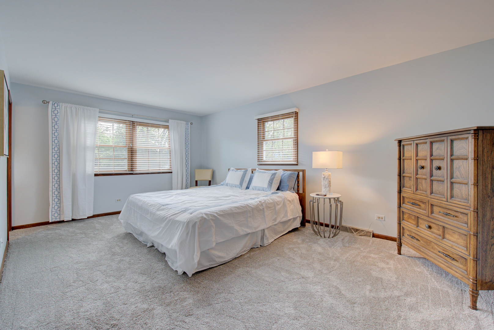 1710 Fender Road Naperville, IL 60565 - Photo 24 of 46 a spacious bedroom with a bed and a window