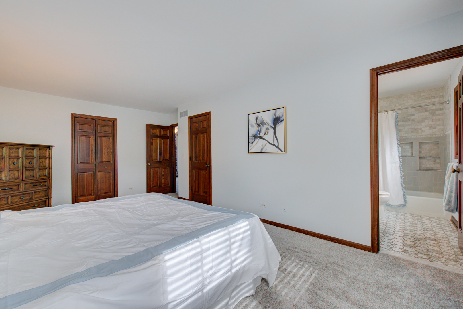 1710 Fender Road Naperville, IL 60565 - Photo 26 of 46 a bedroom with a large bed and mirror