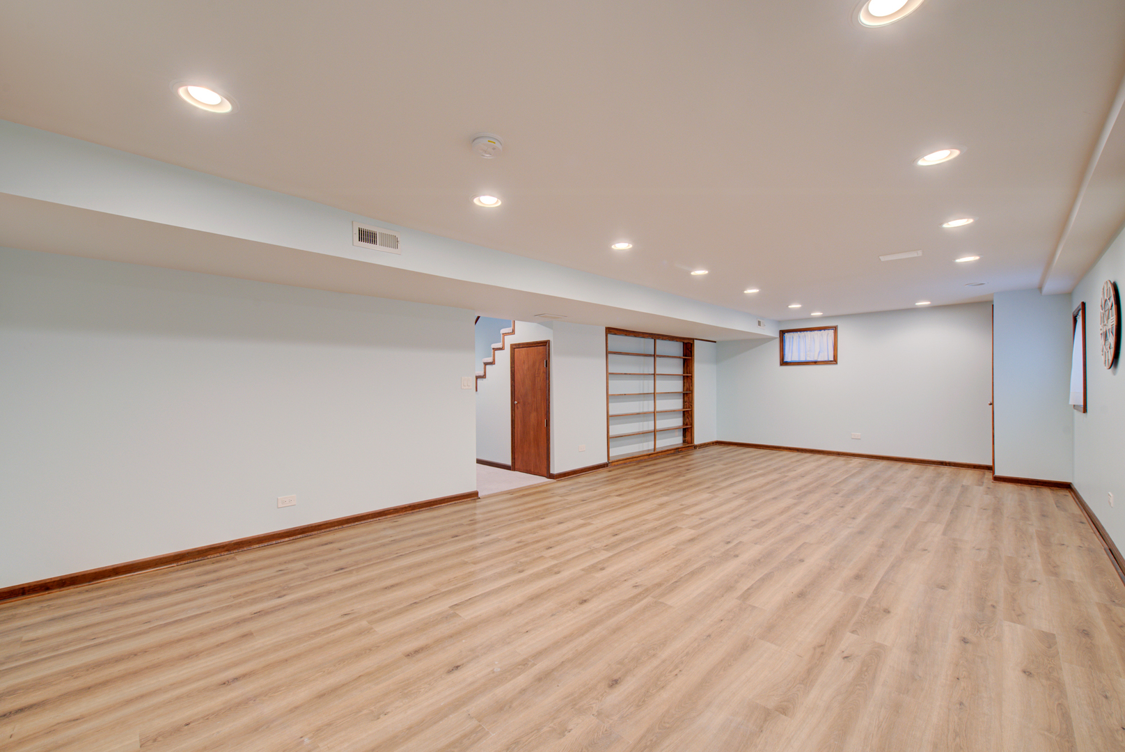 1710 Fender Road Naperville, IL 60565 - Photo 39 of 46 an empty room with wooden floor and windows