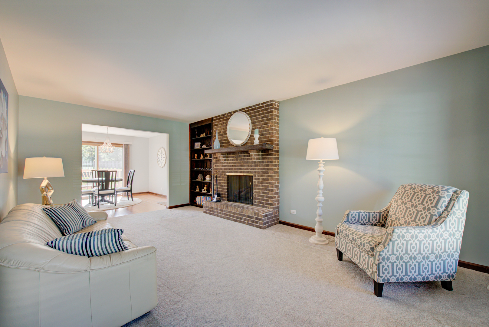1710 Fender Road Naperville, IL 60565 - Photo 5 of 46 a living room with furniture and a fireplace