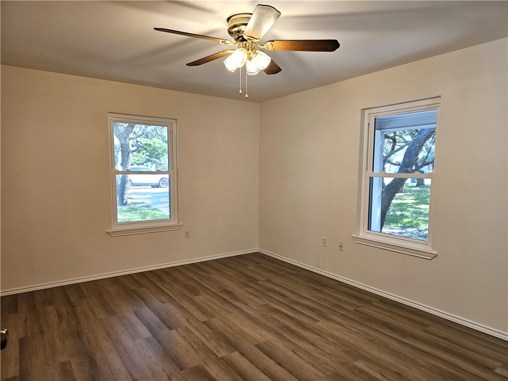 3121 Lenore Avenue Ingleside, TX 78362 - Photo 13 of 24 a view of an empty room with window and wooden floor