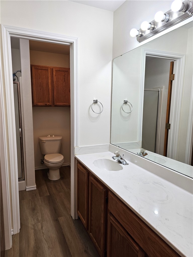 3121 Lenore Avenue Ingleside, TX 78362 - Photo 15 of 24 a bathroom with a sink a toilet and mirror