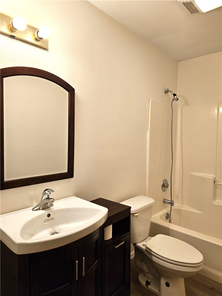 3121 Lenore Avenue Ingleside, TX 78362 - Photo 19 of 24 a bathroom with a sink a toilet and shower