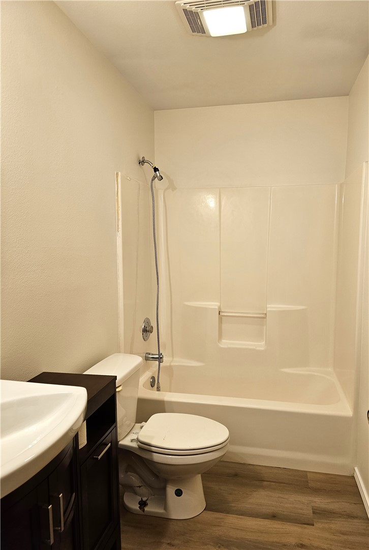 3121 Lenore Avenue Ingleside, TX 78362 - Photo 20 of 24 a bathroom with a toilet a sink and a bathtub
