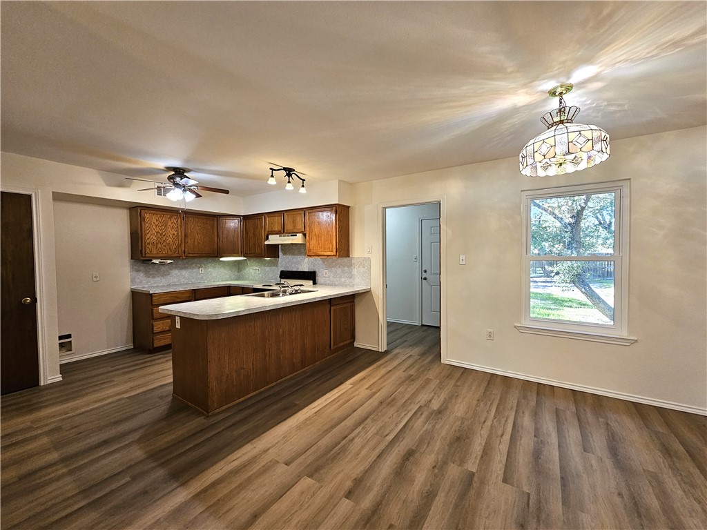 3121 Lenore Avenue Ingleside, TX 78362 - Photo 7 of 24 a large kitchen with a lot of counter space and stainless steel appliances