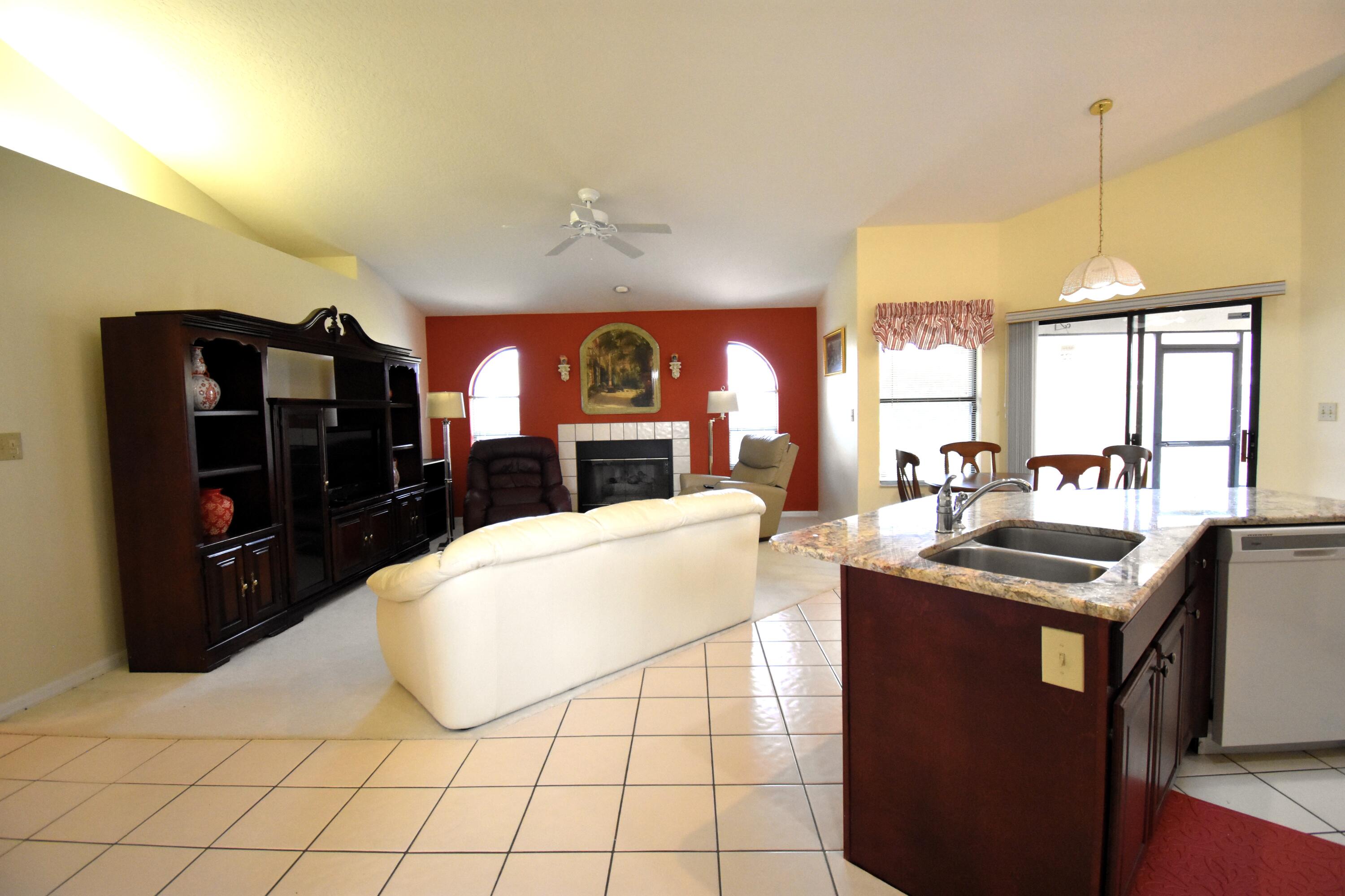 1920 Glen Meadows Circle Melbourne, FL 32935 - Photo 13 of 19 a kitchen with a sink a counter space appliances and cabinets