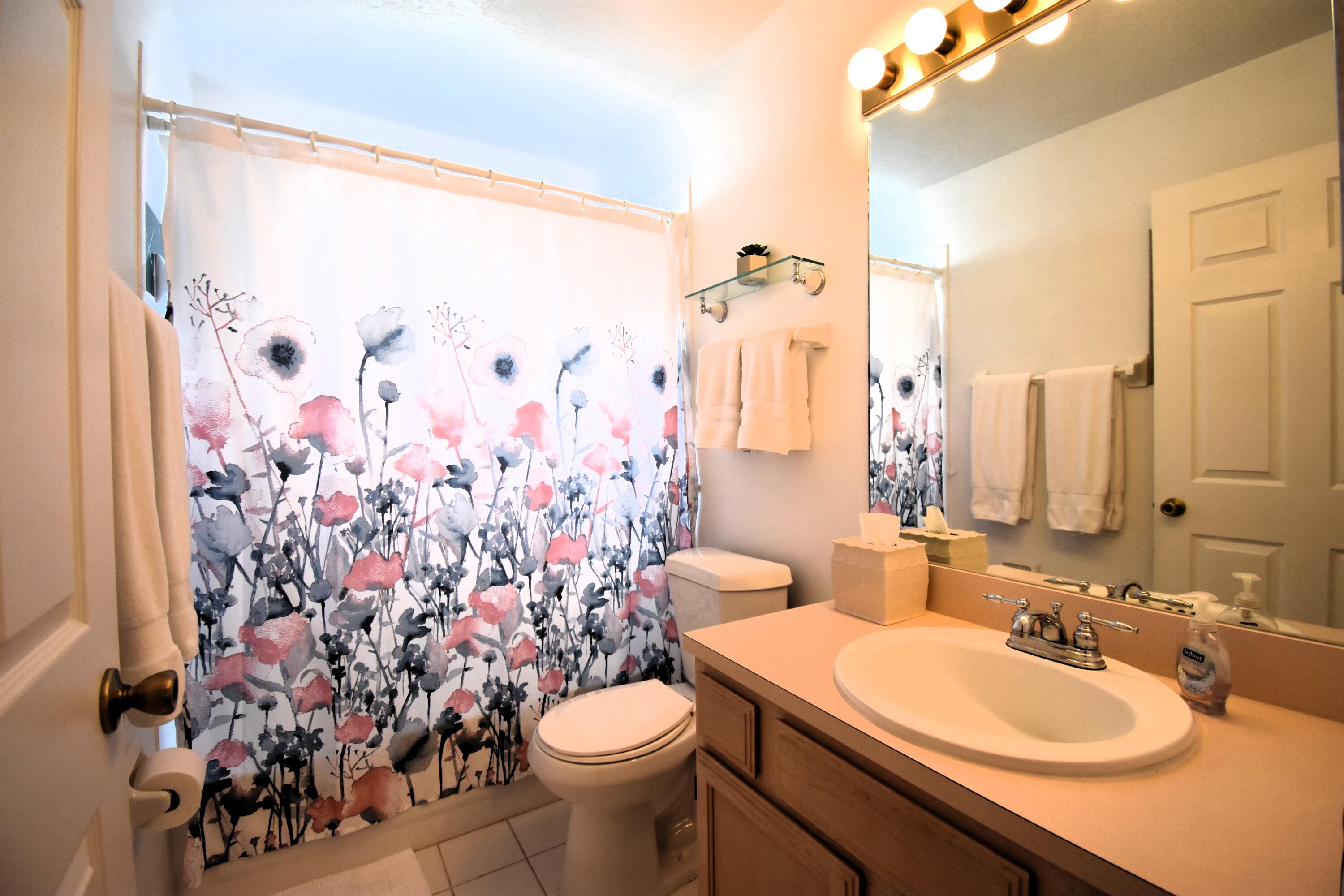 1920 Glen Meadows Circle Melbourne, FL 32935 - Photo 15 of 19 a bathroom with a sink toilet and shower