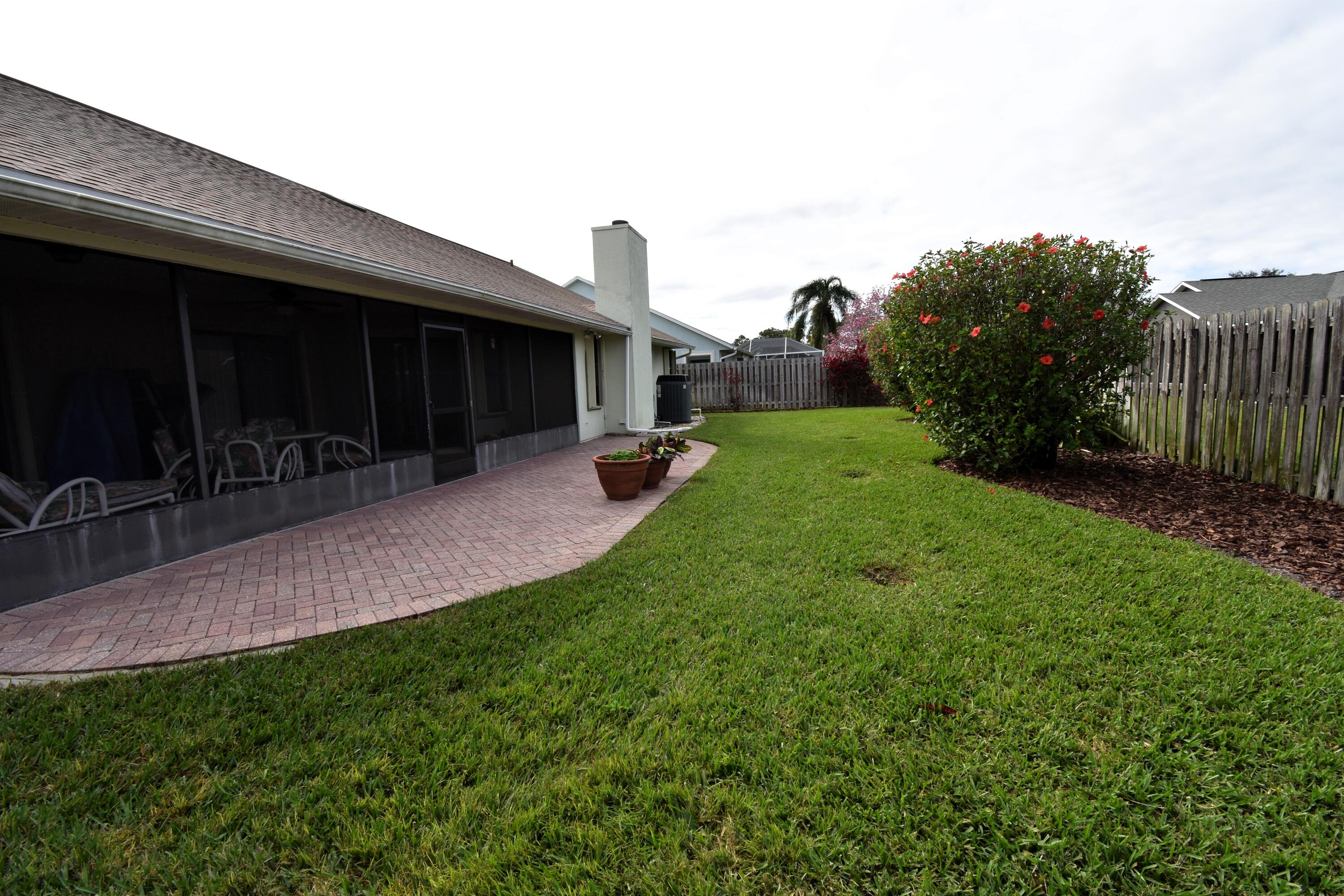 1920 Glen Meadows Circle Melbourne, FL 32935 - Photo 19 of 19 a view of a backyard with sitting area