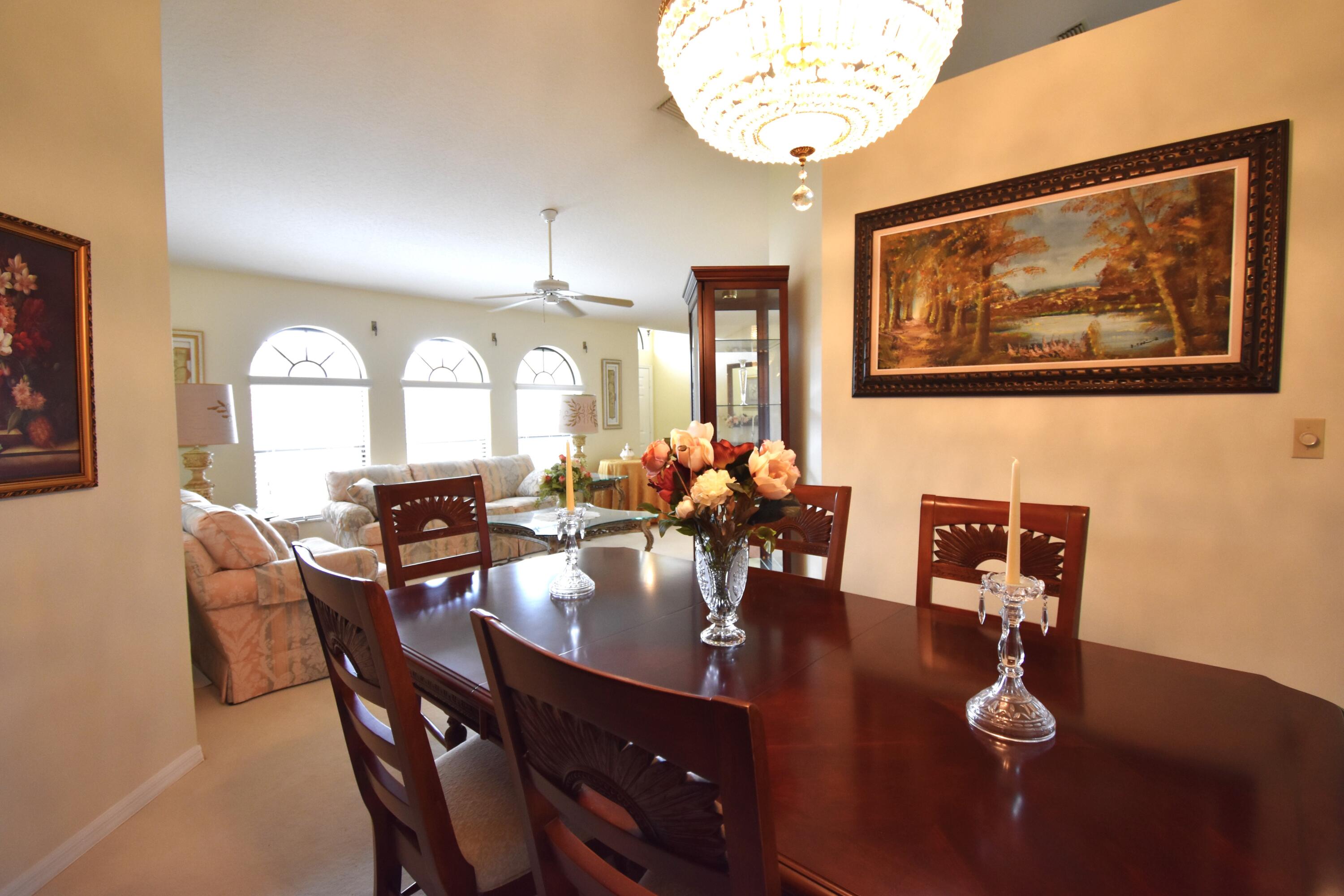 1920 Glen Meadows Circle Melbourne, FL 32935 - Photo 5 of 19 a view of a dining room with furniture and chandelier