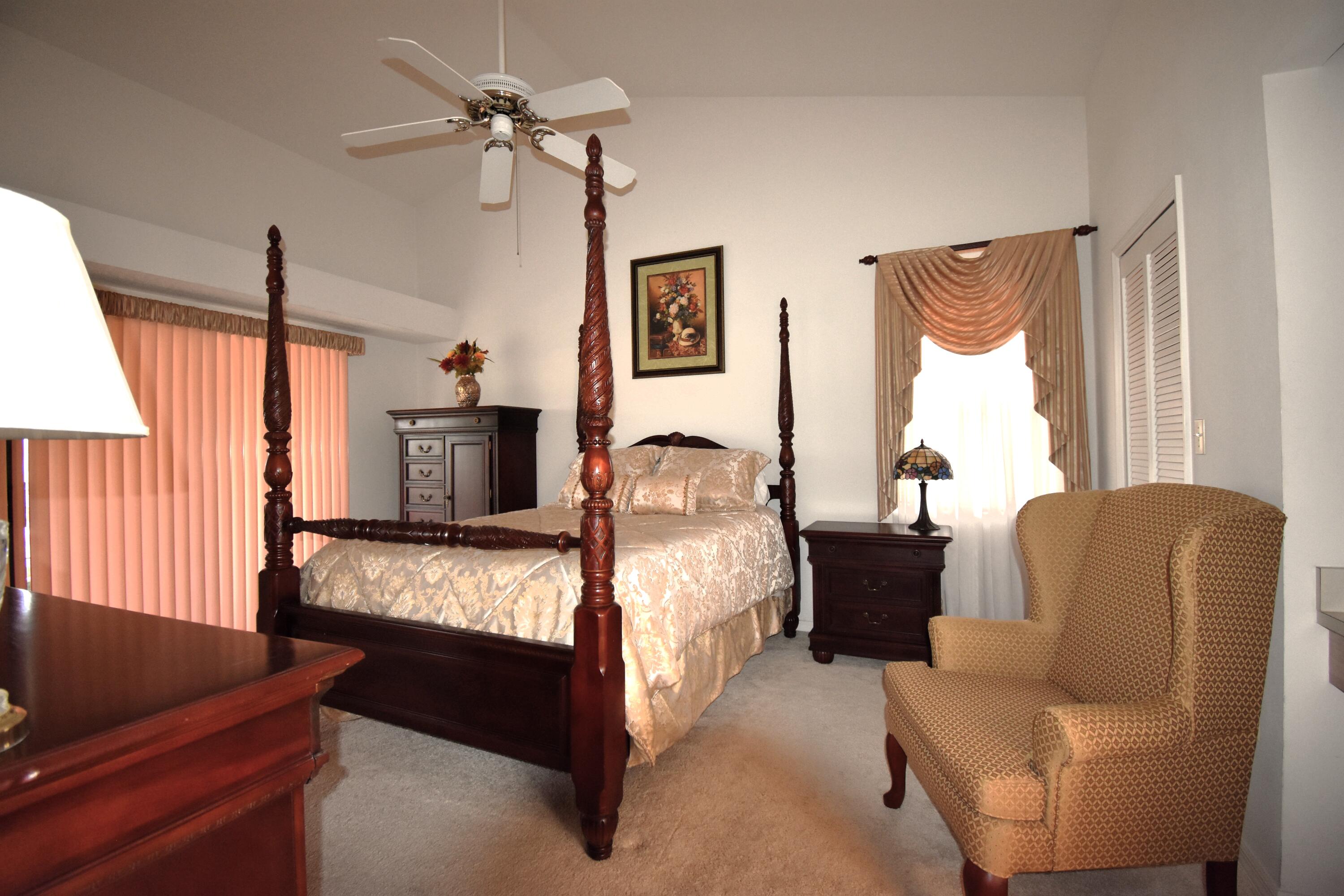 1920 Glen Meadows Circle Melbourne, FL 32935 - Photo 6 of 19 a bed room with furniture and a window