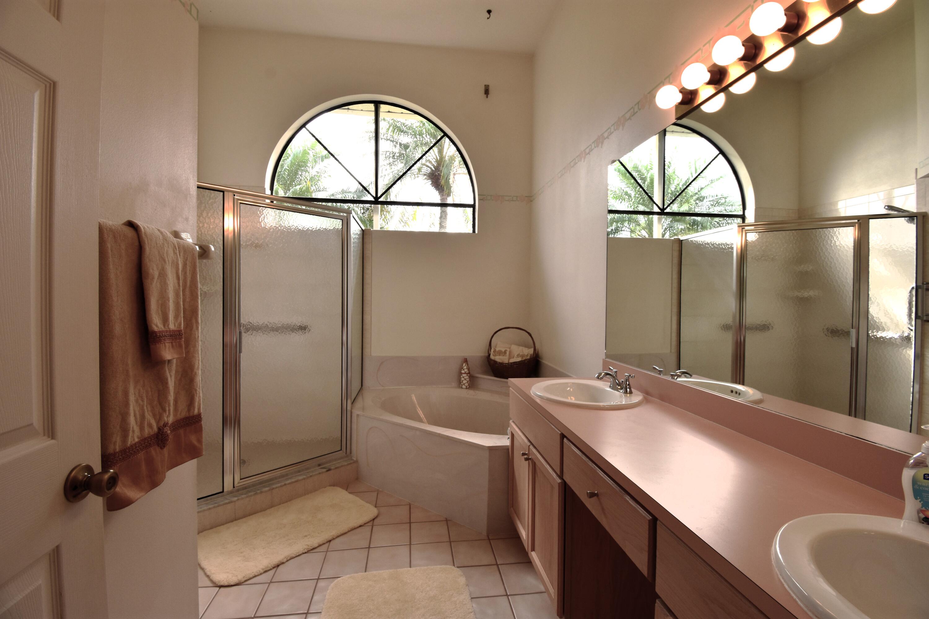 1920 Glen Meadows Circle Melbourne, FL 32935 - Photo 8 of 19 a bathroom with a sink a toilet and a mirror