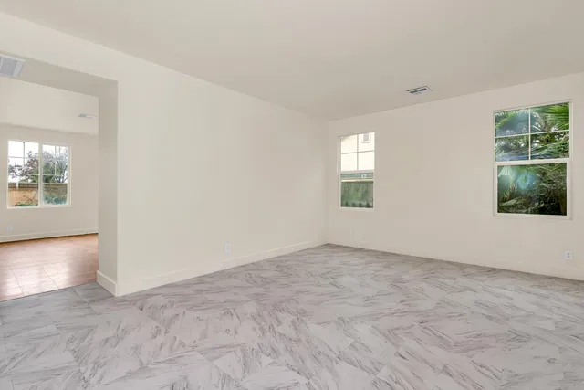 an empty room with windows