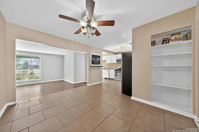 a view of an empty room with a window