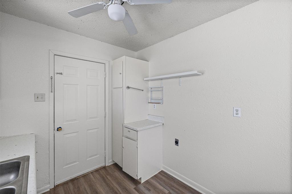 500 Highway 22 Meridian, TX 76665 - Photo 12 of 28 a view of an empty room with wooden floor