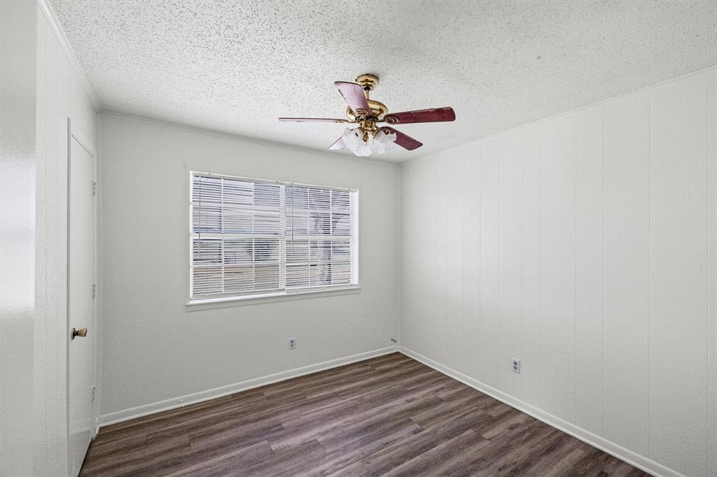 500 Highway 22 Meridian, TX 76665 - Photo 15 of 28 wooden floor in an empty room with a window