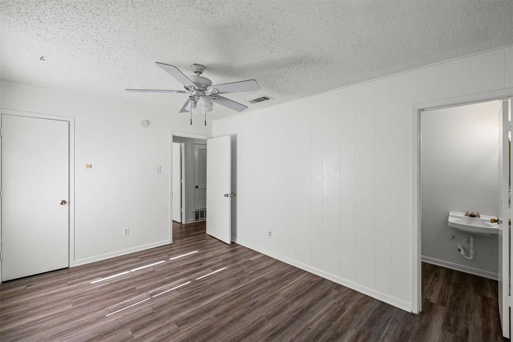 500 Highway 22 Meridian, TX 76665 - Photo 19 of 28 wooden floor in an empty room with a window