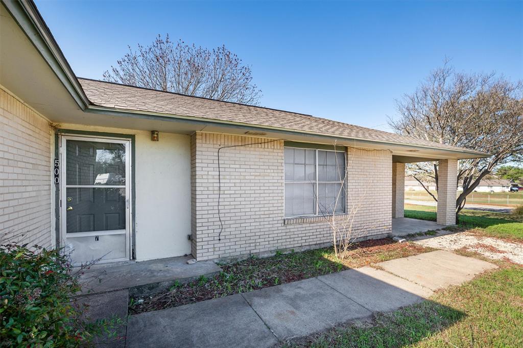 500 Highway 22 Meridian, TX 76665 - Photo 2 of 28 a front view of a house with garden