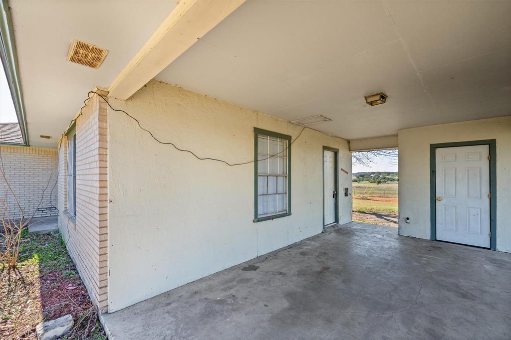 500 Highway 22 Meridian, TX 76665 - Photo 24 of 28 a view of a livingroom with wooden floor and stairs